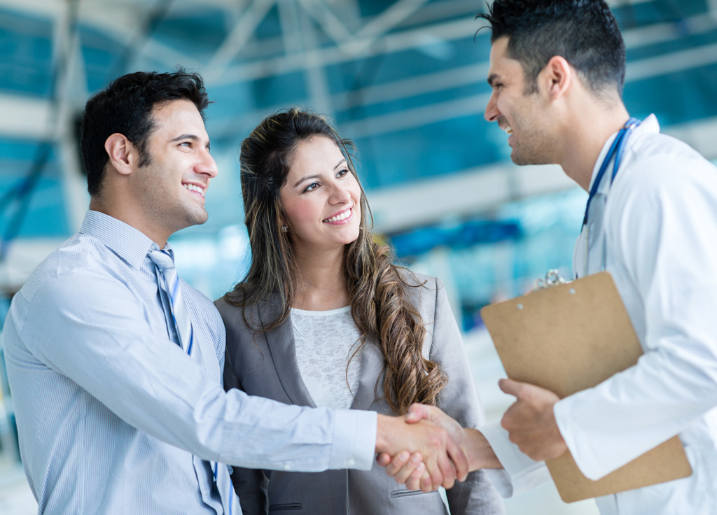 Doctor and patients shaking hands